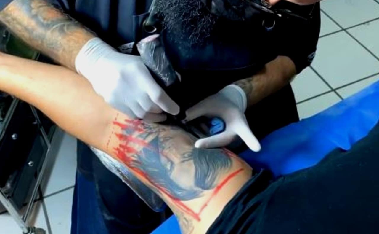 tatuaje de Belinda en brazo Lupillo Rivera